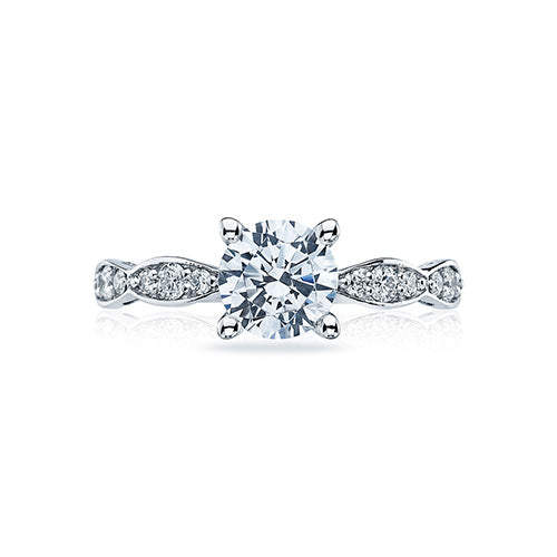 Elegant marquise shapes flourish along the diamond band of this simply stunning solitaire with crescent engraving and milgrain details adorning the side profile.This engagement ring can accommodate a variety of center diamond sizes; starting at 1 carats