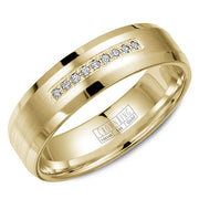 A wedding band in yellow gold with a brushed center, featuring nine diamoinds and beveled edges.