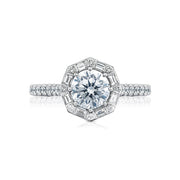 A truly regal engagement ring, this beauty features an art deco bloom with baguettes and round diamonds dancing around your round center. Brilliant pav  set diamonds in a French cut setting dance along the ceiling of the high polished band with hidden diamond details along the inner face.