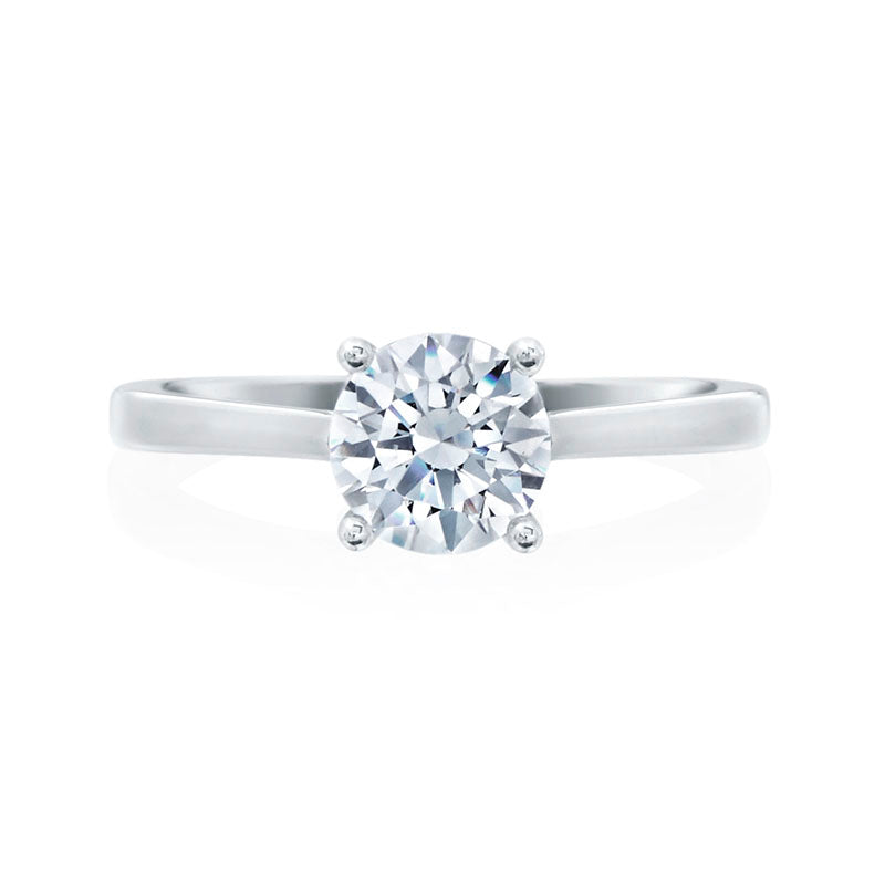 This 18KW 0.03ctw Diamond Round Brilliant Solitaire Semi Mounting is the picture of sophisticated simplicity. A classic, timeless look she will cherish for years to come. Pricing below only reflects setting and does not include the diamond. This setting can be made to hold a diamond with carat weight ranging from 0.5ct and above. Pricing varies according to carat weight of the center diamond. Starting at $995.