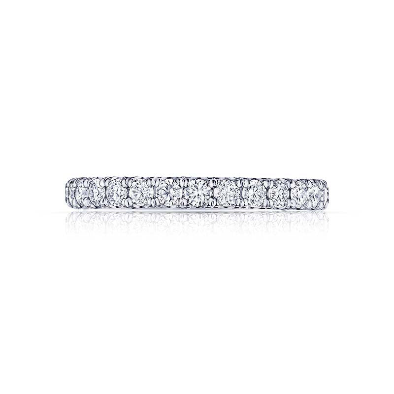 Let this brilliant wedding band symbolize your eternal love! With almost .98 carats of diamonds on this beautiful string of diamonds; let your love shine and sparkle with every move of your finger.