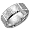 A white gold wedding band with a hammered finish and notch detailing.