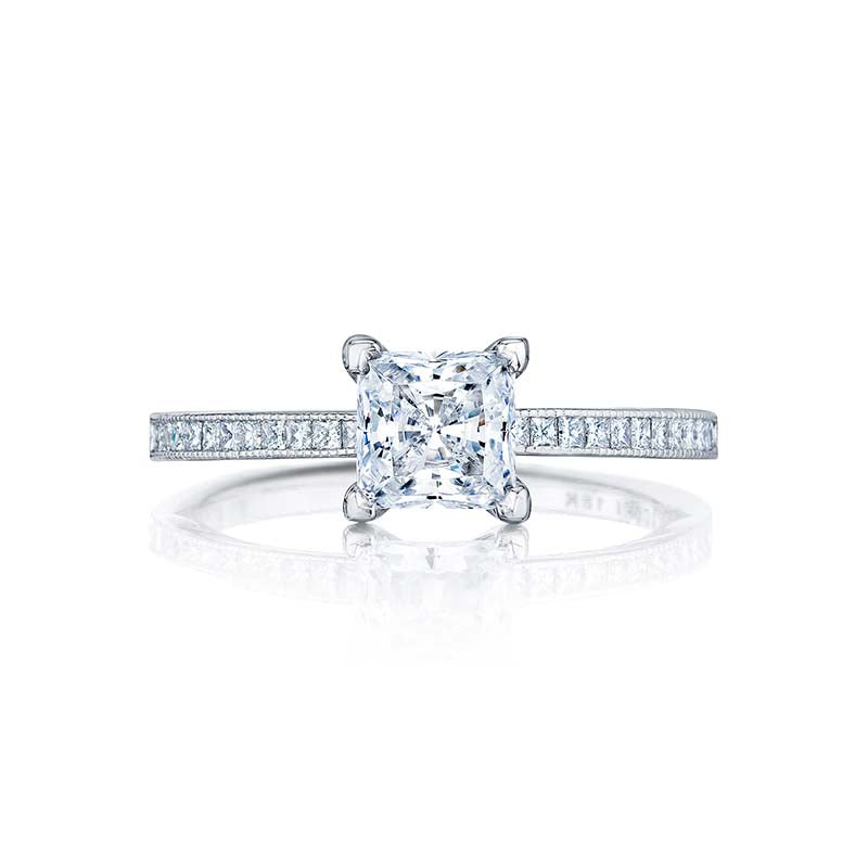The clean look of channel set princess cut diamonds and regal floating crescent designs makes this princess setting fit for a queen.This engagement ring can accommodate a variety of center diamond sizes; starting at 0.5 carats
