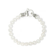 A bracelet of freshwater cultured pearls. Finished with a signature lobster clasp. Pearls vary from 7 to 8mm. Worn as a single strand or layer with other LAGOS bracelets for added interest.- Sterling Silver- Signature Lobster Clasp- Pearl measures 7-8mm- STYLE #: 05-80896