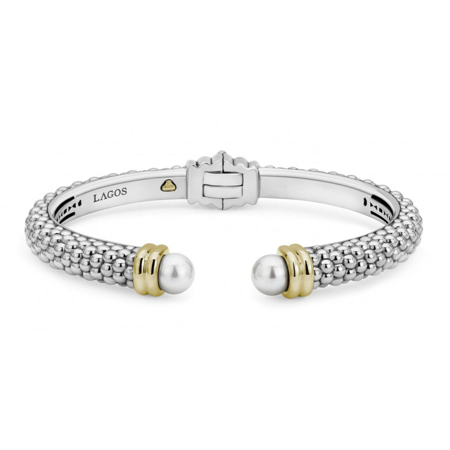 Crafted sterling silver Caviar beading with 18K gold forms this cuff bracelet detailing freshwater cultured pearl end caps. Finished with a hinge clasp.-Sterling Silver & 18K Gold-Hinged Clasp-Pearl measures 7mm-STYLE #: 05-81358