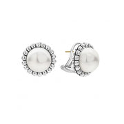 Classic freshwater cultured pearl earrings framed by flutes of sterling silver. Just the right touch for every day. Finished with 14k gold posts and omega backing.- Sterling Silver- Omega Clip and Post- Diameter 17mm- Pearl measures 12mm- STYLE #: 01-81051-00