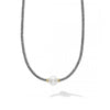 A freshwater cultured pearl station with Caviar beading in 18K gold and sterling silver on this 16 inch necklace. Finished with a signature lobster clasp detailing the LAGOS crest in 18K gold.- Sterling Silver & 18K Gold- Width 3mm- Length 16 Inches- Pearl measures 9mm- STYLE #: 04-80969-M18