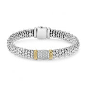 Diamonds highlighted by 18K gold with sterling silver Caviar beading. Finished with a signature box clasp. LAGOS diamonds are the highest quality natural stones.- Sterling Silver & 18K Gold- 0.62 Carat- Double Button Box Clasp- Width 9mm- STYLE #: 05-81258-DD