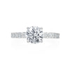 This engagement ring from the Moyer Collection was created for a bride that wants a unique touch! Fourteen emerald cuts weighing 1.22ctw diamonds cover the 3/4 of the shank. A round brilliant center diamond sits comfortably atop this gorgeous ring. Center stone not included in price. 