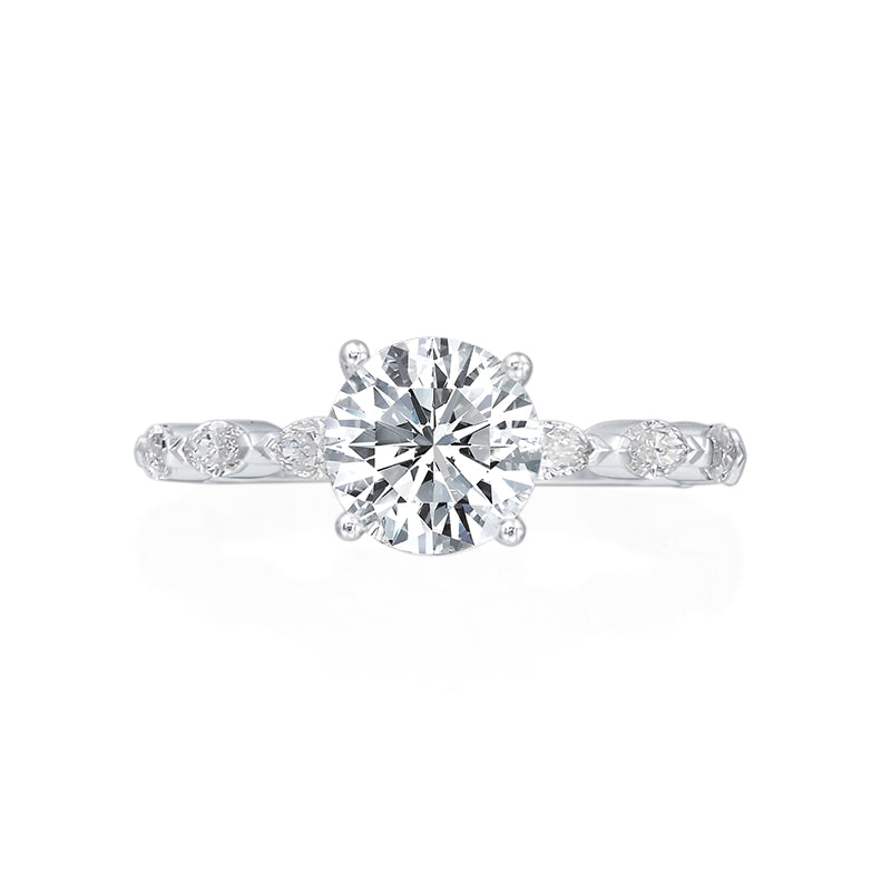 This engagement ring is perfect for stacking fun geometric shaped wedding bands! Almost 3/4 of the shank is covered with 0.64ctw Marquise shaped diamonds. A round brilliant center stone sits just above the marquise stones. Center stone not included in price. 