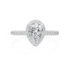 This dainty, sophisticated engagement ring in 14K White Gold puts all of the emphasis on the center pear shaped diamond. A halo of 0.35ctw round brilliant diamonds accentuates the beauty of the pear shape. Under the cathedral style head is a small single diamond- a nice touch for the wearer! Center stone not included in pricing. 