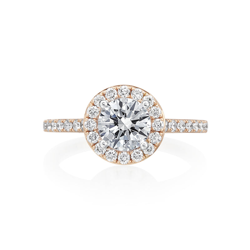 Our take on the classic halo engagement ring with diamonds down the sides of the ring. We love the high cathedral style setting of this engagement ring. This ring, like all other engagement rings in the Moyer Collection is complete with a small sapphire set in the inside of the shank. Center stone is not included in the pricing. 