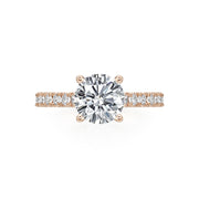 Simple and sophisticated with a lot of sparkle! This 14K Rose Gold Semi-Mount is adorned with diamonds 3/4 way around the shank of the ring. Center stone is not included in the price. 