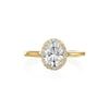Designed with the intention of putting all of the spotlight on the center oval diamond, this ring is dainty and timeless. There are 0.21ctw diamonds in the halo and adorning the profile on both sides of the ring. Inside the shank, there is a small blue sapphire with the Moyer logo- a signature feature in all Moyer Collection engagement rings. Center stone is not included in the price. This ring can be made to fit any size or shape center diamond. 