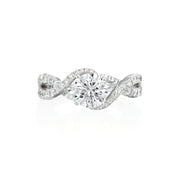 One of the Moyer Collections most unique, dynamic designs, this engagement ring features a swirl, criss cross design with graduated diamond patterns featuring prong set diamonds and bezel set diamonds. In this design, there are 0.71ctw diamonds that are G-H in color, SI1-2 in clarity. Inside the shank, there is a small blue sapphire and the Moyer logo, a signature feature on all Moyer Collection engagement rings. Center stone is not included in price. This ring can be custom made to fit any size