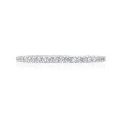 This 18K white gold Jack Kelege wedding band fits perfectly next to almost any engagement ring. Diamonds weighing 0.26 carat total weight travel half way around this wedding band. 