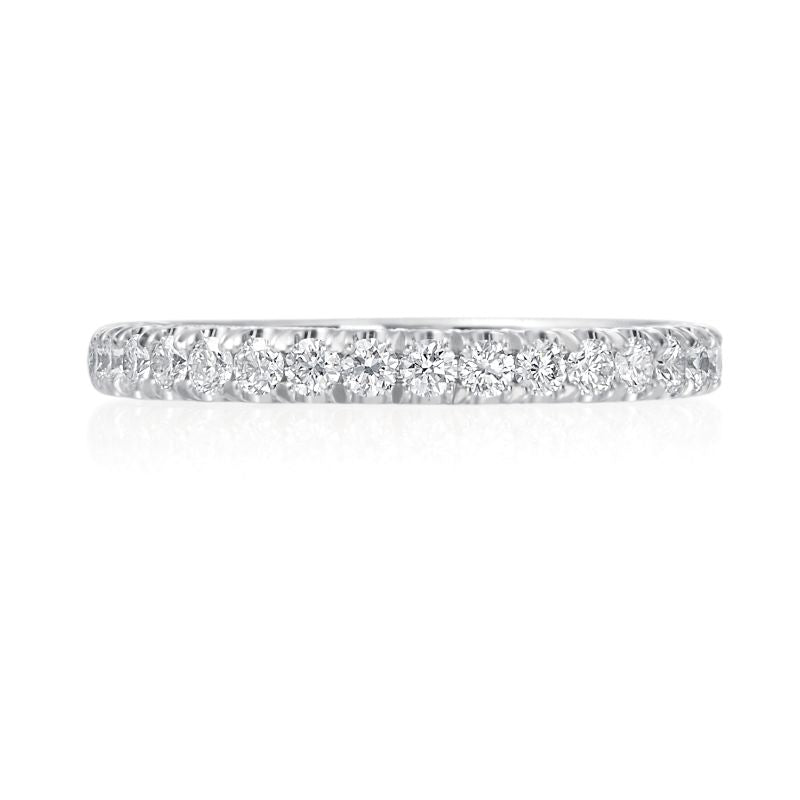This platinum Jack Kelege wedding band fits perfectly next to almost any engagement ring. Diamonds weighing 0.40 carat total weight travel half way around this wedding band. 