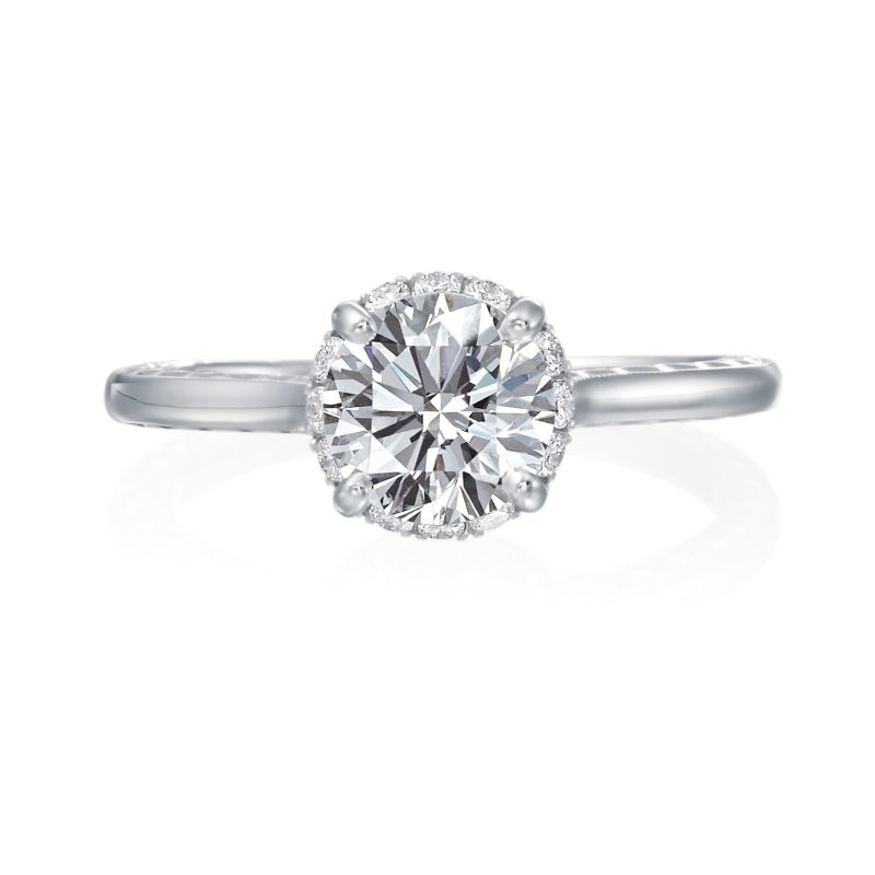 Jack Kelege makes the most beautiful halo engagement rings that have gorgeous hidden details for the wearer to enjoy. From the side profile, the wearer gets an even better glimpse of the hidden diamond bezel halo . On the shank of the mounting are beautiful etched carvings and intricate milgrain detail.  Center diamond is not included in the price shown. 