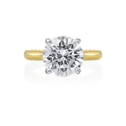 Jack Kelege makes the most beautiful solitaire engagement rings that have gorgeous hidden details for the wearer to enjoy. Although the shank of the ring is made in 18K yellow gold, the diamond is set in a 18K white gold head to reflect bright white light.  From the side profile, the wearer gets a glimpse of beautiful etched carvings and intricate milgrain detail. Center diamond is not included in the price shown. 