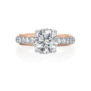 This beautiful Jack Kelege ring is a work of art featuring both platinum and 14k rose gold. Underneath the center diamond, beautiful diamond scrollwork captures your attention. On the shank of the ring, there is a row of diamonds set in platinum and framed with 14k rose gold, giving the bride a two-tone look. Center diamond is not included in the price shown. 