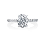 The center oval diamond will take center stage in this Jack Kelege engagement ring. On the shank, diamonds shine from all three sides. On the profile, diamonds are bezel set and there are gorgeous etchings and milgrain details. Center diamond is not included in the price shown.  