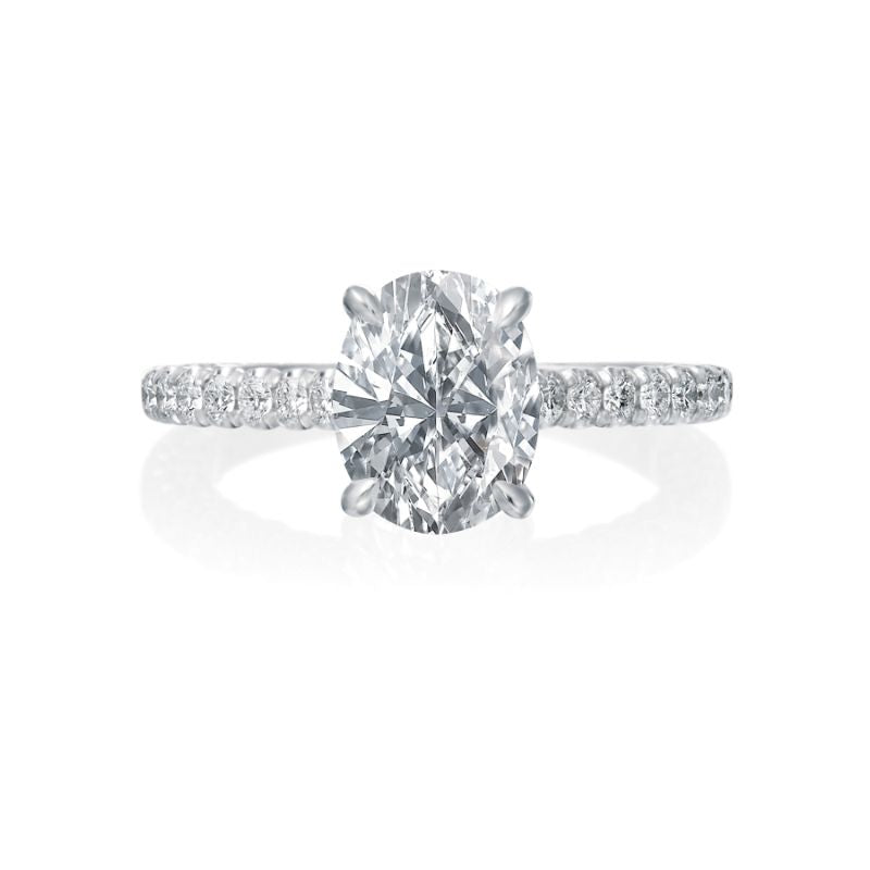 The center oval diamond will take center stage in this Jack Kelege engagement ring. On the shank, diamonds shine from all three sides. On the profile, diamonds are bezel set and there are gorgeous etchings and milgrain details. Center diamond is not included in the price shown.  