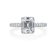 Jack Kelege makes the most beautiful engagement rings that have gorgeous hidden details for the wearer to enjoy. From the top, the wearer sees a beautiful emerald cut diamond with small round brilliant diamonds traveling half way around the shank. From the side profile, the wearer gets a glimpse of the beautiful etched carvings and intricate milgrain detail.  Center diamond is not included in the price shown. 