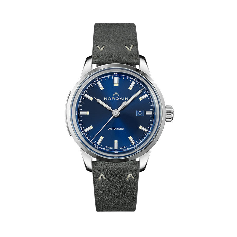 Those who wear a Freedom 60 watch on their wrist can feel the vibes of the 60s. Our inspiration from the new positive attitude towards travel, exploring, and the experience of individual freedom, all combined with our love for attention to detail, have led us to this design classic. The characteristics of this collection are the incredibly beautiful design elements -- starting with the vintage straps with the unique NORQAIN stitches, followed by the box type glass with its origin in the 60s and 