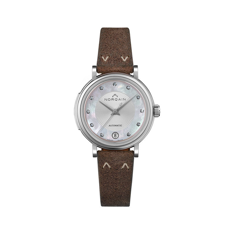 Those who wear a Freedom 60 watch on their wrist can feel the vibes of the 60s. Our inspiration from the new positive attitude towards travel, exploring, and the experience of individual freedom, all combined with our love for attention to detail, have led us to this design classic. The characteristics of this collection are the incredibly beautiful design elements -- starting with the vintage straps with the unique NORQAIN stitches, followed by the box type glass with its origin in the 60s and 
