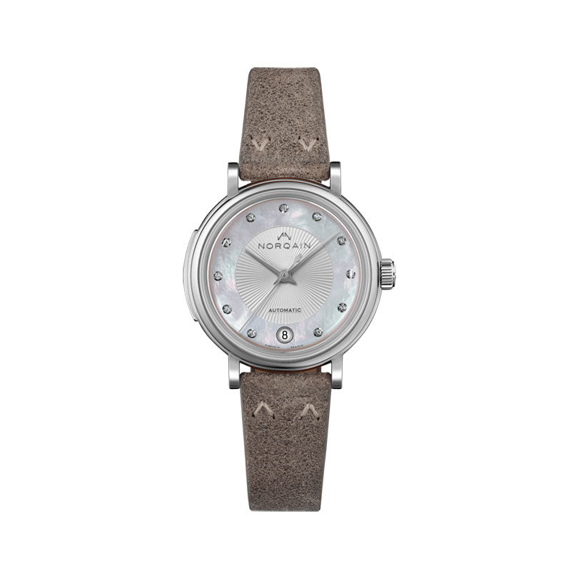 Those who wear a Freedom 60 watch on their wrist can feel the vibes of the 60s. Our inspiration from the new positive attitude towards travel, exploring, and the experience of individual freedom, all combined with our love for attention to detail, have led us to this design classic. The characteristics of this collection are the incredibly beautiful design elements -- starting with the vintage straps with the unique NORQAIN stitches, followed by the box type glass with its origin in the 60s and 