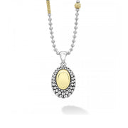A smooth station of 18K gold set by sterling silver Caviar beading forms this oval pendant. Finished on ballchain necklace that adjusts from 16 to 18 inches.- Sterling Silver & 18K Gold- Signature Lobster Clasp- 16 to 18 Inch 2.5mm Ball Chain- Dimensions 34mm x 17mm- STYLE #: 07-81157-ML