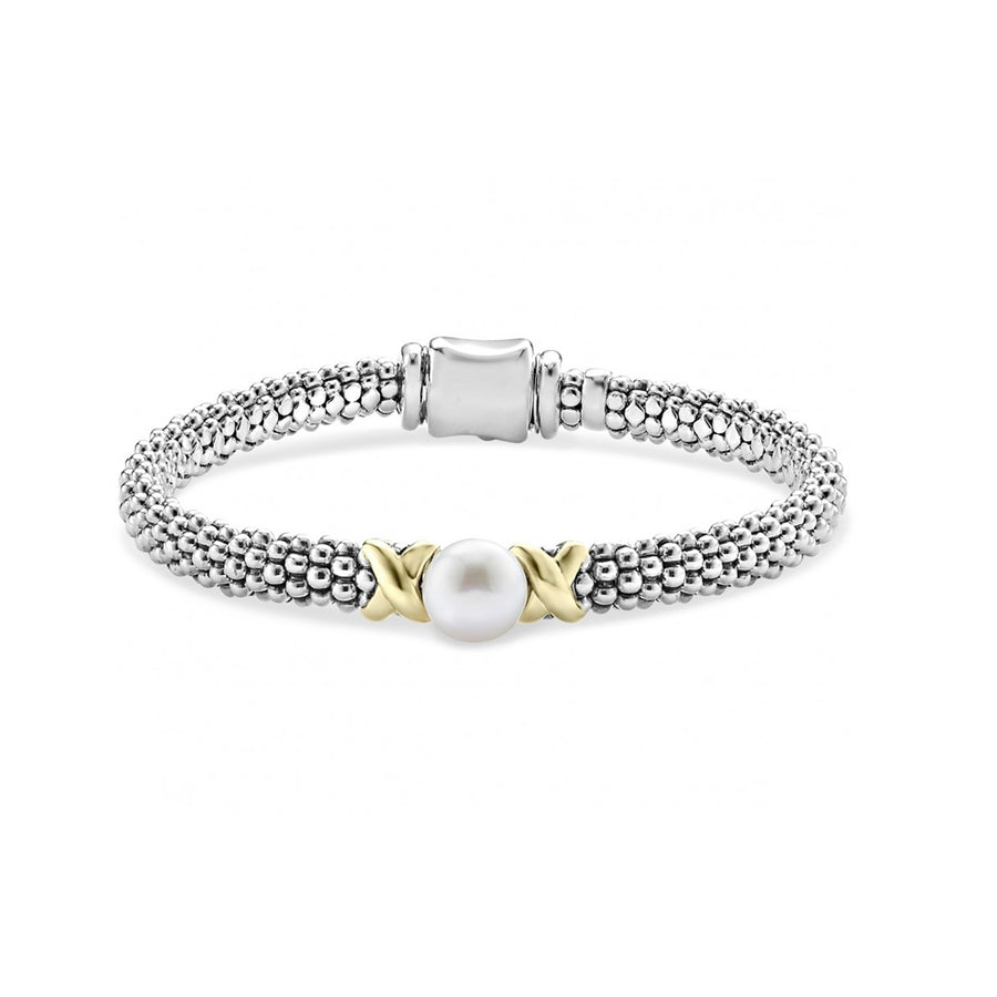 A sterling silver Caviar bracelet with freshwater cultured pearl framed by two 18K gold x stations. Finished with a signature box clasp.- Sterling Silver & 18K Gold- Box Clasp- Width 6mm- Pearl measures 8mm- STYLE #: 05-80884