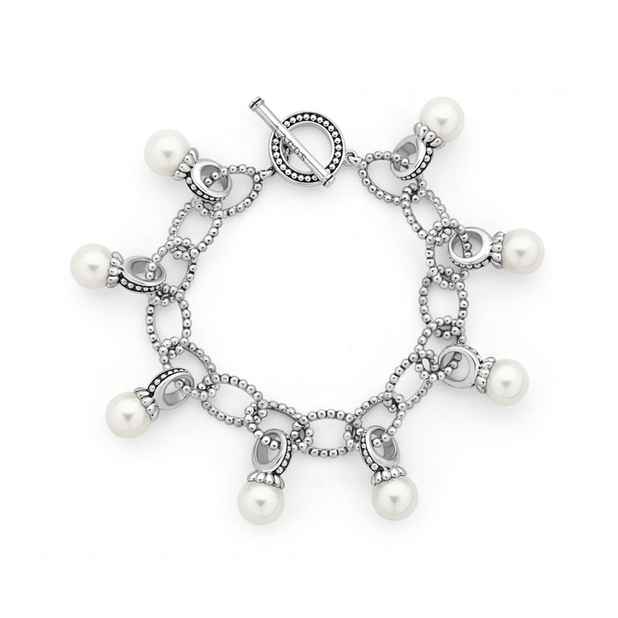 Eight freshwater cultured pearls with sterling silver links form this toggle bracelet.- Sterling Silver- Toggle Clasp- Pearl measures 9mm- STYLE #: 05-81366