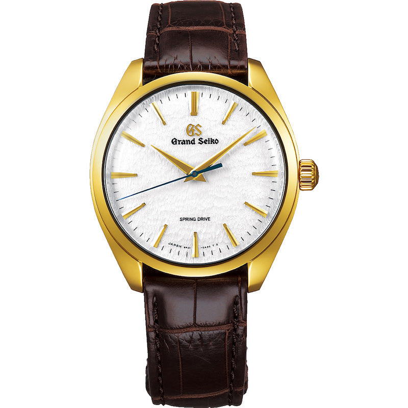 The 18K yellow gold case is polished by a special Zaratsu method created to accentuate the beauty of the curved surfaces. The new manual-winding Spring Drive caliber, 9R31, has two mainsprings set in parallel within a single barrel, but still captures the signature glide motion seconds hand reflecting the natural and continuous flow of time, with the same high precision rate of one second a day and delivers a power reserve of 72 hours. Dial Color: White. Water Resistance: 30m. Features: Time. Mo