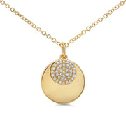 A 14k yellow gold 0.09ctw diamond disc sits on top of a larger yellow gold disc in this beautiful everyday necklace! 