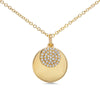 A 14k yellow gold 0.09ctw diamond disc sits on top of a larger yellow gold disc in this beautiful everyday necklace! 