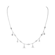 This 14K white gold necklace is adorned with 6 dangle drop diamonds and diamonds scattered on the chain in between the drops. This necklace would be a great addition to any formal outfit! 