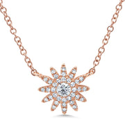 Diamonds truly burst in this 14K rose gold starburst necklace! One larger diamond is placed at the center of the starburst with smaller diamonds fanning out throughout the rest of the necklace. 