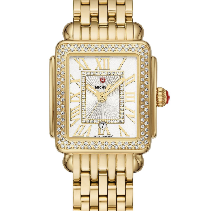 This 18K gold-plated Deco Madison Mid shines with 148 hand-set diamonds on the bezel and atop the silver white sunray dial. The 18K gold-plated bracelet is made specifically for the Deco Madison Mid collection and is interchangeable with any 16mm MICHELE strap.