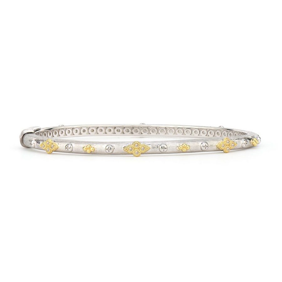 From the Mixed Metal Collection, the Mixed Metal Alternating Quad Bangle features bezel set diamond and 18K gold quads set on a sterling silver bangle with the signature brushed JFJ finish.
