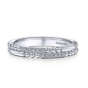 One of the most unique band designs in the Gabriel & Co. collection, this 14K white gold wedding band features beading and diamonds in an intriguing pattern. Stack this band in with your existing wedding bands! 