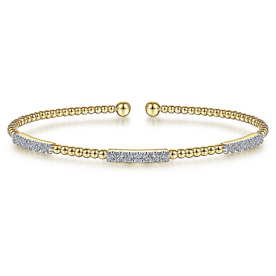 This exquisite Yellow Gold Bangle will have you feeling elegant the moment you put it on. Beaded and accented with three diamond clusters, only at Gabriel & Co.  