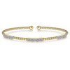 This exquisite Yellow Gold Bangle will have you feeling elegant the moment you put it on. Beaded and accented with three diamond clusters, only at Gabriel & Co.  