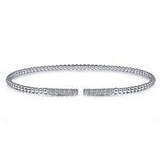 As white gold beads seamlessly transition into .30c diamonds, youll feel nothing but joy when you wear this bangle from Gabriel & Co.