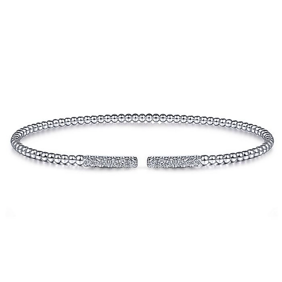 As white gold beads seamlessly transition into .30c diamonds, youll feel nothing but joy when you wear this bangle from Gabriel & Co.