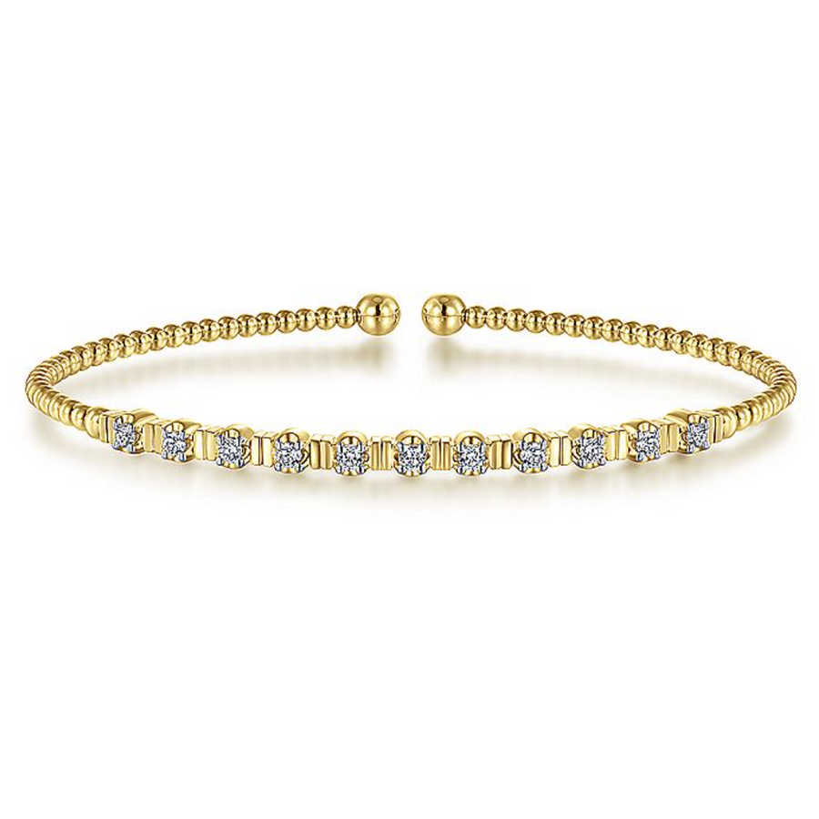 As 11 round dazzling diamonds encircle this gorgeously beaded 14K Gold Bangle, all eyes will be on you. Available in Rose, Yellow, and White Gold at Gabriel & Co.  
