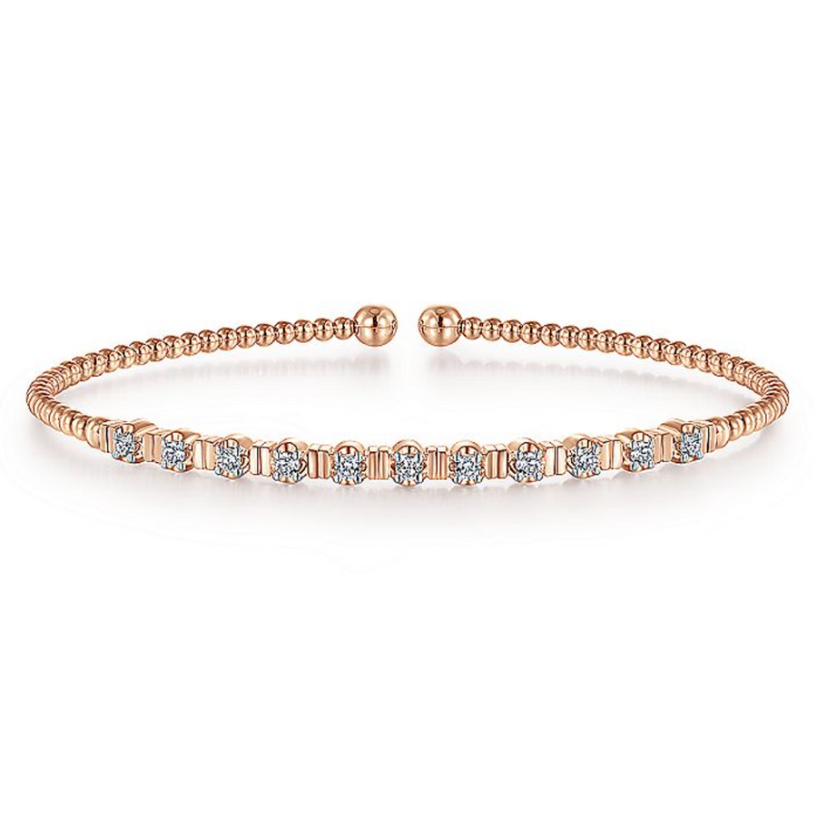 Diamonds evenly spaced throughout a rose gold bangle create a sparkle that will make you glow. Beads in 14K rose gold instantly grab the attention of anyone around you, and 11 round dazzling diamonds are set across the top of the bracelet for the perfect compliment to any outfit.   