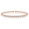 Diamonds evenly spaced throughout a rose gold bangle create a sparkle that will make you glow. Beads in 14K rose gold instantly grab the attention of anyone around you, and 11 round dazzling diamonds are set across the top of the bracelet for the perfect compliment to any outfit.   