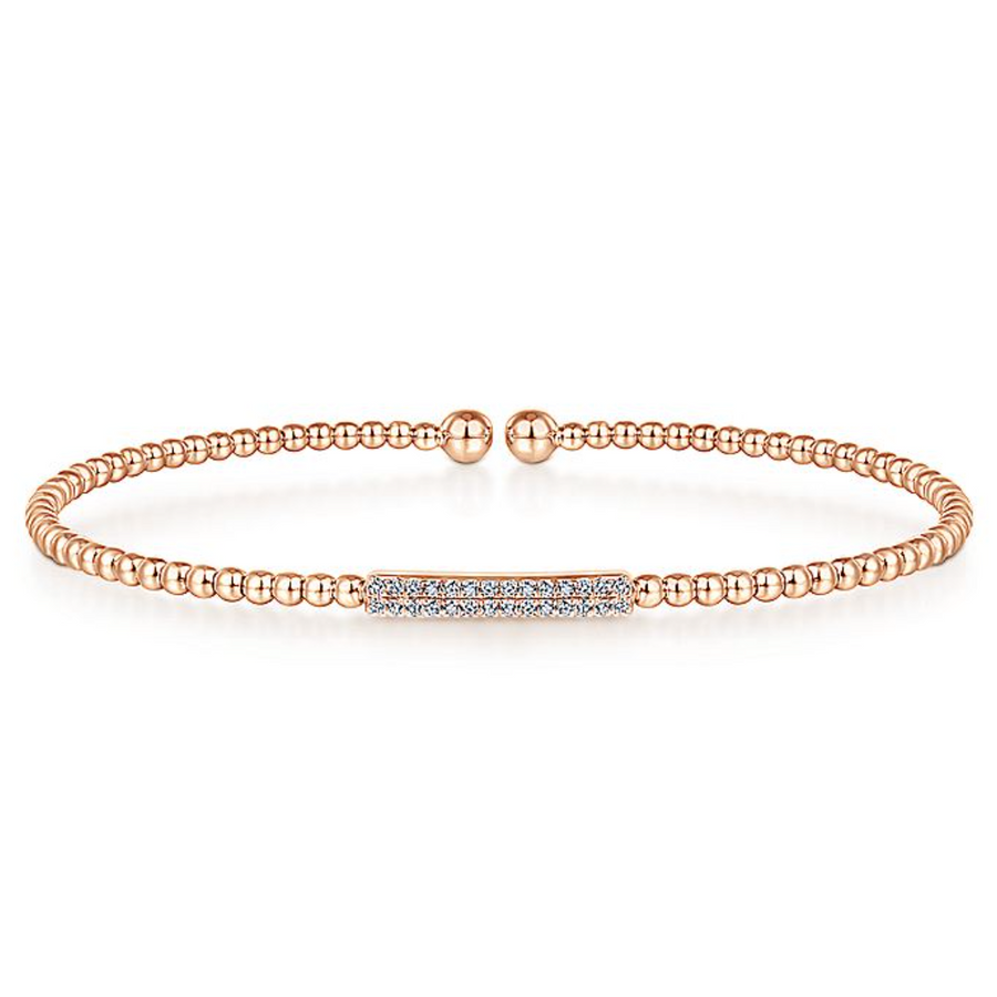 The words stylish and sweet will come to the mind of anyone who sees you wearing this bangle. Delicate touches of 14K rose gold combine with a simple bar of pristine diamonds. You can pair this bracelet with other jewelry for a fashionable mix, or wear by itself for an understated compliment to your wardrobe.   