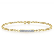 Sweet and delicate are the descriptors that come to mind when you see this 14k diamond bangle. In the center are rows of tiny, simple diamonds to create a glamourous and subtle look. This bracelet can be worn by itself or combined with other bracelets to go with whatever look you are going for.  